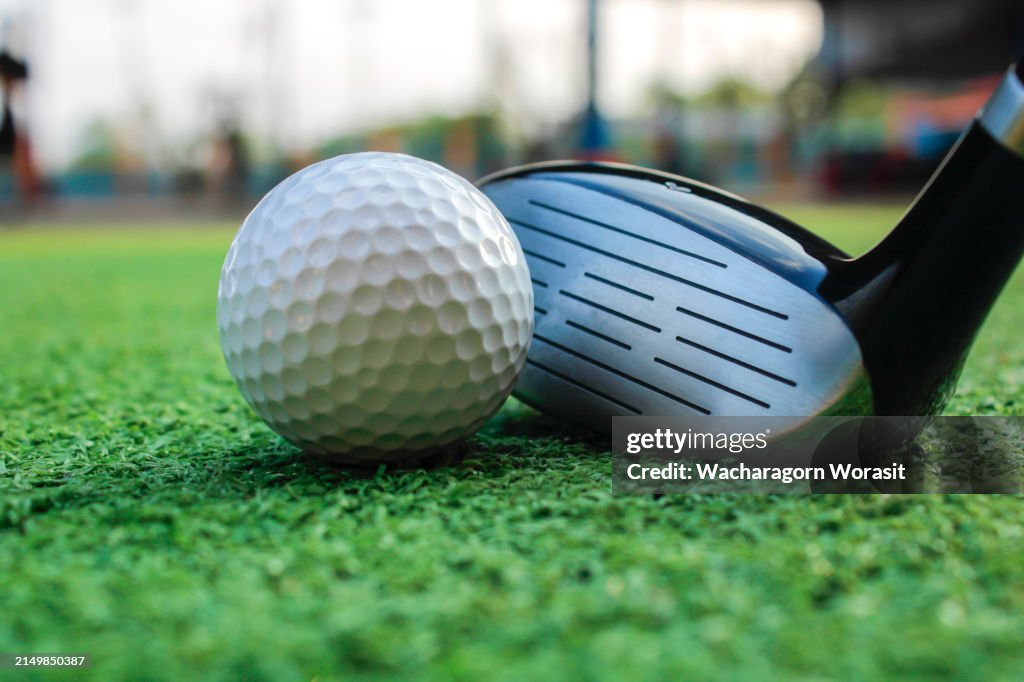 Golf ball placed on artificial grass.