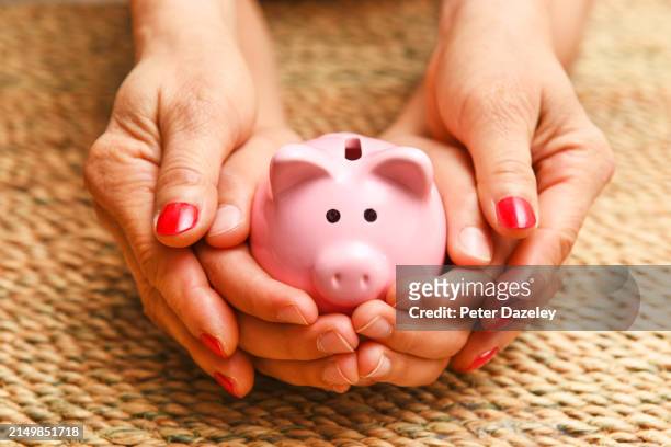 mother and son with savings - budding tween stock pictures, royalty-free photos & images