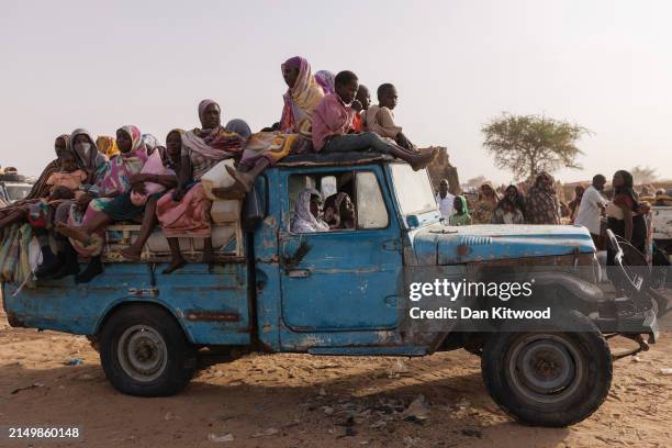 Newly arrived refugees from Darfur in Sudan, sit on a vehicle before being taken to a new camp on April 23, 2024 in Adre, Chad. Since the beginning...