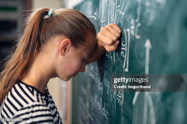 teenage girl in math class overwhelmed by the math formula. - young mathematician stock pictures, royalty-free photos & images