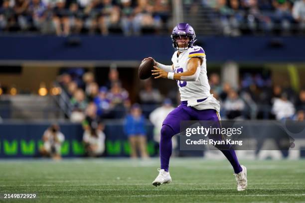 Jaren Hall of the Minnesota Vikings rolls out and looks to throw a pass during an NFL preseason football game against the Seattle Seahawks at Lumen...