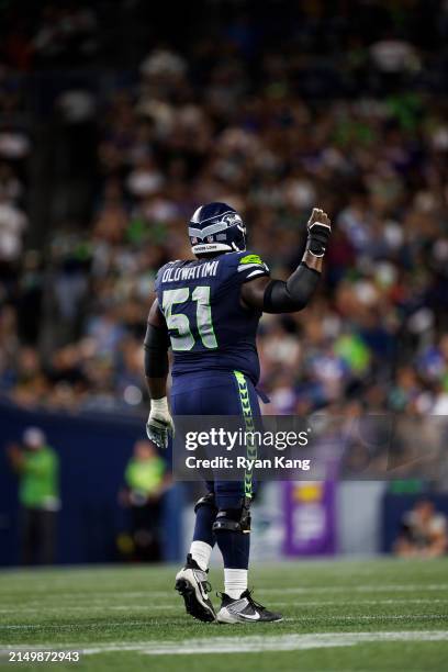Olu Oluwatimi of the Seattle Seahawks reacts during an NFL preseason football game against the Minnesota Vikings at Lumen Field on August 10, 2023 in...