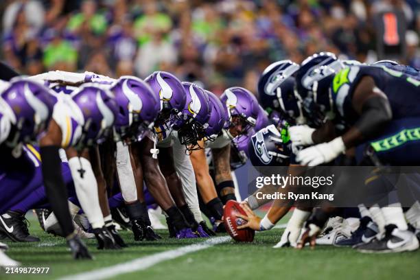 The Minnesota Vikings defense gets set at the line of scrimmage against the Seattle Seahawks offense prior to the snap during an NFL preseason...
