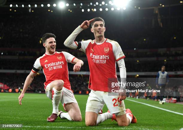 Kai Havertz of Arsenal celebrates scoring his team's third goal with teammate Declan Rice during the Premier League match between Arsenal FC and...