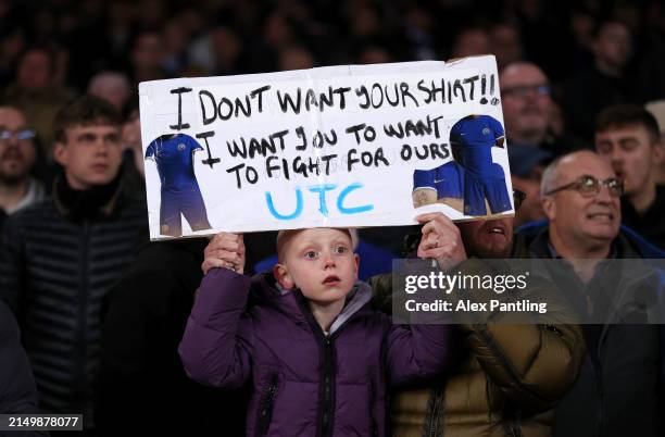 Chelsea fan holds up a banner reading 'I don't want your shirt! I want you to want to fight for ours' during the Premier League match between Arsenal...
