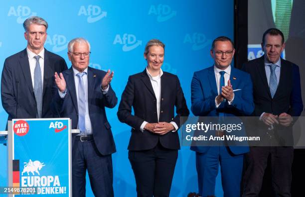Alice Weidel and Tino Chrupalla co-leaders of the far-right Alternative for Germany political party, pose together with supporters at the end of the...