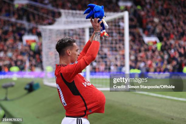 Antony of Manchester United celebrates with a ball under his shirt holding a Sonic the Hedgehog teddy bear after scoring their 1st goal during the...