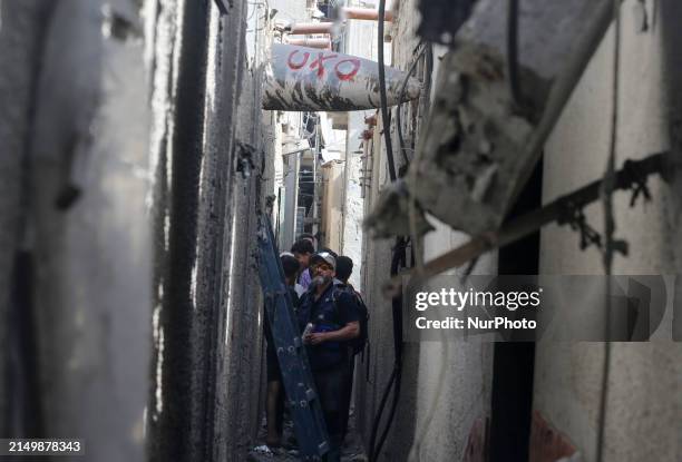 Members of Humanity and Inclusion UK are examining and marking significant Israeli unexploded weapons to try to ensure maximum safety in Deir Balah...