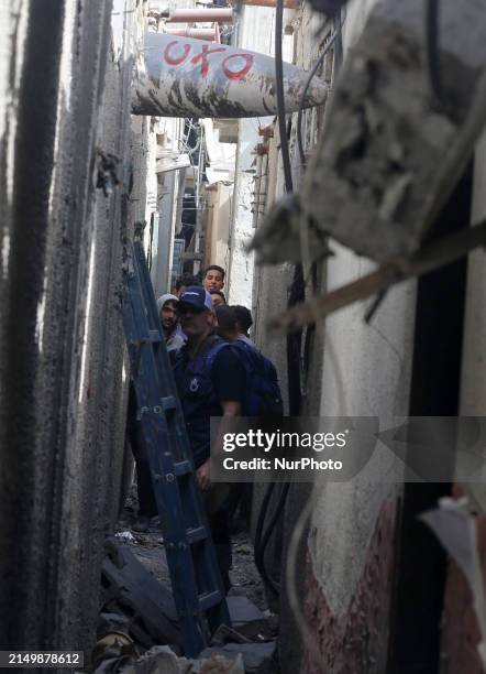 Members of Humanity and Inclusion UK are examining and marking significant Israeli unexploded weapons to try to ensure maximum safety in Deir Balah...