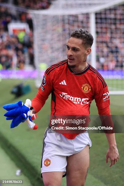 Antony of Manchester United celebrates with a ball under his shirt holding a Sonic the Hedgehog teddy bear after scoring their 1st goal during the...