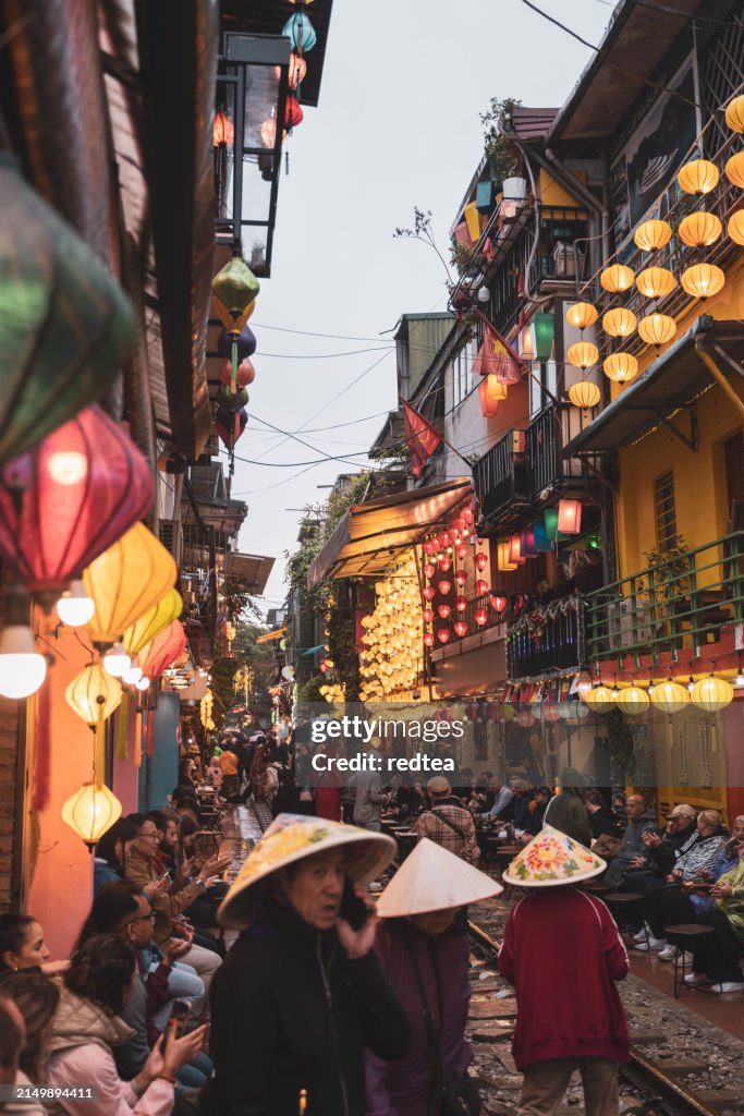 Famous train street in Hanoi, Vietnam, the train passes through the narrow streets