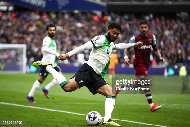 Joe Gomez of Liverpool is preparing to cross the ball during the Premier League match between West Ham United and Liverpool at the London Stadium in...