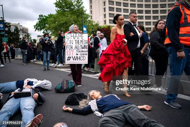 Demonstrators try to block arriving guests outside of the Washington Hilton, the site of the Annual White House Correspondents Dinner, on April 27,...