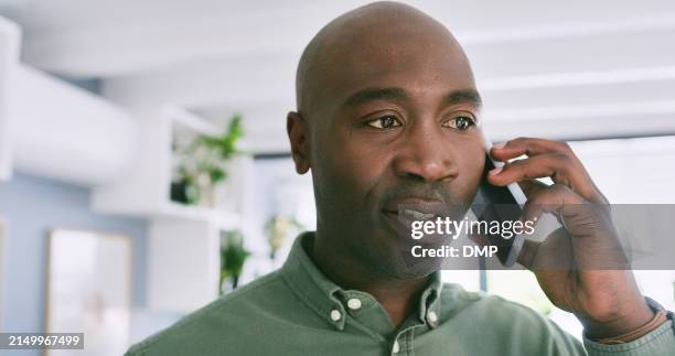 designer, black man and talking with phone call in office for project updates or client communication and decision making. person, mobile and conversation for feedback or task development and advice. - african american ethnicity stock pictures, royalty-free photos & images