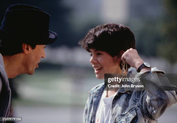 American actor, director, screenwriter, and producer Sylvester Stallone and his son Sage Stallone on the set of Rocky V, directed by John G. Avildsen.
