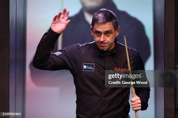 Ronnie O'Sullivan of England walks out to play against Jackson Page of Wales in their first round match during day five of the Cazoo World Snooker...