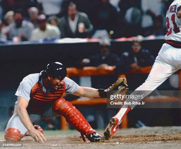 Boston Red Sox Catcher Carlton Fisk just misses tag on California Angeles Wally Joyner at close play at home plate during American League Playoff...