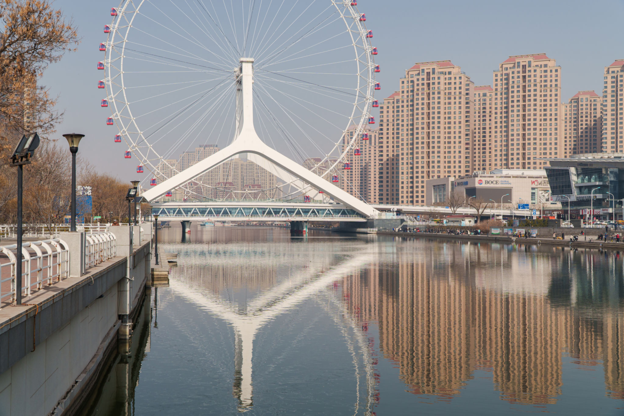 Ferris wheel and reflection of the in the water Ferris wheel and reflection of the in the water