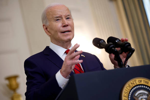 President Joe Biden delivers remarks after signing legislation giving $95 billion in aid to Ukraine, Israel and Taiwan in the State Dining Room at...