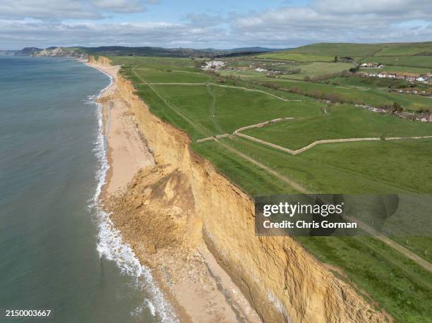 In an aerial view, cliff fall at Burton Bradstock Dorset on the Jurassic Coast on April 192, 2024 in Burton Bradstock, Dorset, England. Members of...