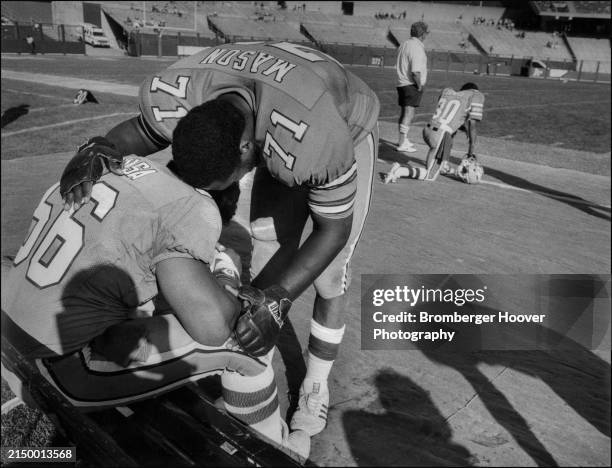 View of American football player Roger Levasa and Lindsey Mason, both of the USFL's Oakland Invaders at the Oakland Coliseum, Oakland, California,...