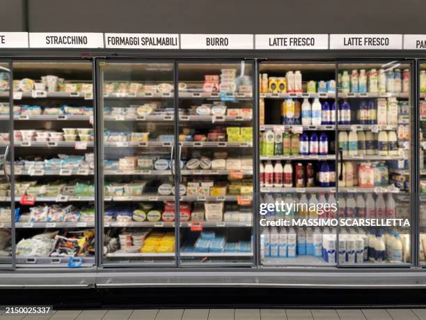 refrigerators with fresh foods in an italian supermarket - refrigerated section supermarket stock pictures, royalty-free photos & images