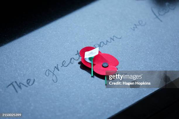 Poppies lie on the Tomb of the Unknown Warrior during Anzac Day dawn service at Pukeahu National War Memorial Park on April 25, 2024 in Wellington,...