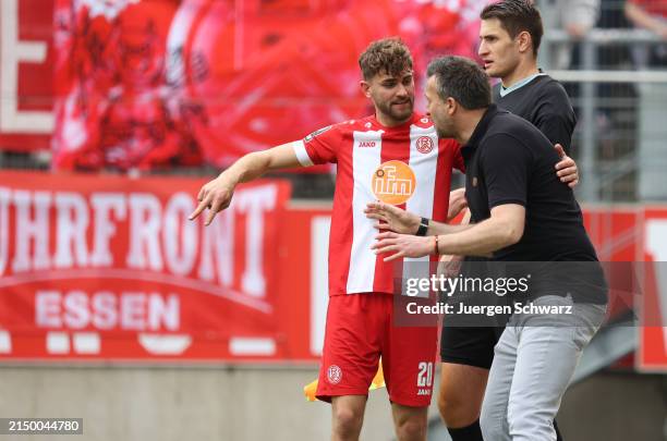 Christoph Dabrowskiof Essen talks to Leonardo Vonic during the 3. Liga match between Rot-Weiss Essen and FC Ingolstadt on April 28, 2024 in Essen,...