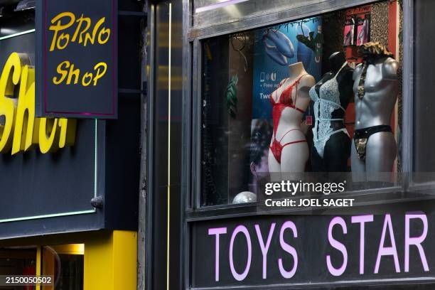 The showcase of a sex shop is pictured near Place Pigalle in Paris on April 28, 2024.
