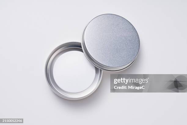 opened aluminum jar on white background - round box lid stock pictures, royalty-free photos & images
