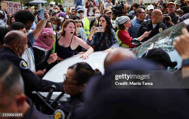Pro-Palestine demonstrators argue with USC public safety officers after officers attempted to take down an encampment in support of Gaza at the...