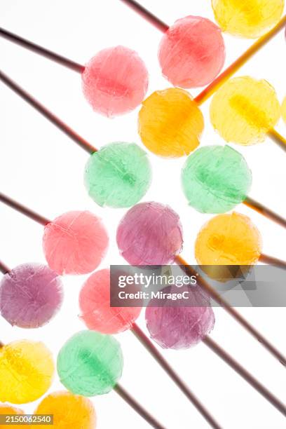 colorful lollipop candies backlit - lollipop stock pictures, royalty-free photos & images