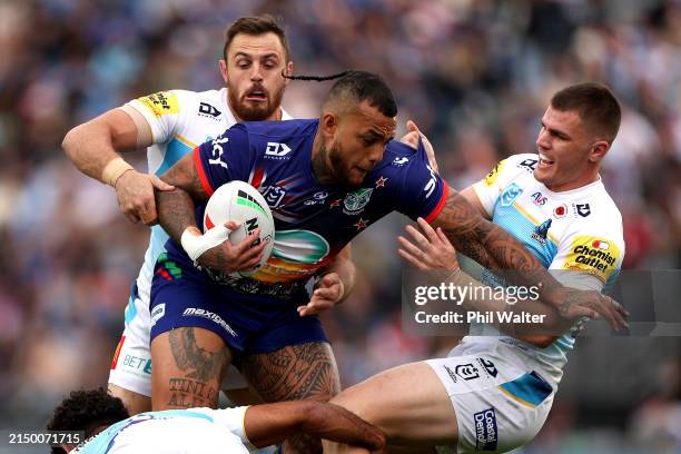 Addin Fonua-Blake of the Warriors is tackled during the round eight NRL match between New Zealand Warriors and Gold Coast Titans at Go Media Stadium...