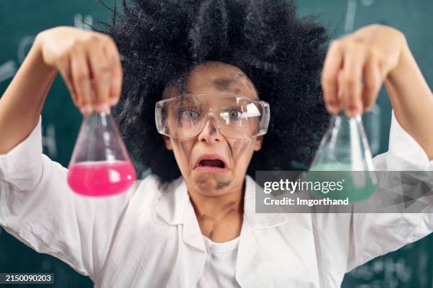 crazy little scientist making crazy little experiments. - crazy scientist stock pictures, royalty-free photos & images
