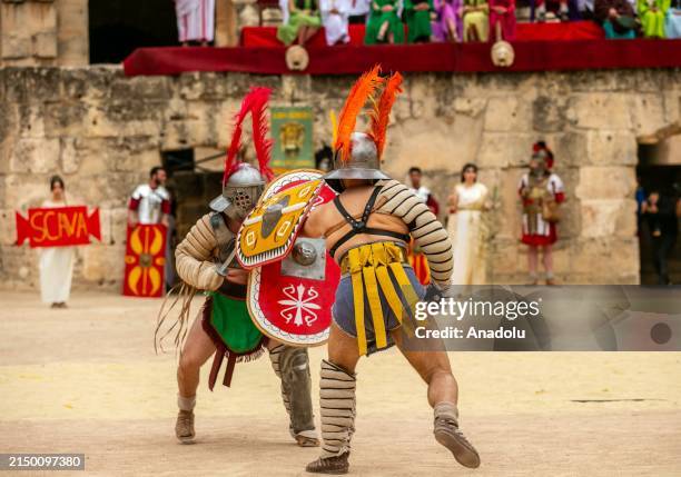 Tunisians gather at the Amphitheater of El Djem for the 'Thysdrus Rome Days' Festival in El Djem in Mahdia Governorate south of Tunis, Tunisia on...