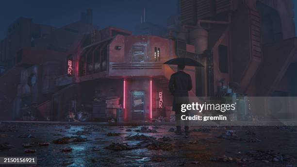 lonely man standing in dark street at night - cyberpunk stock pictures, royalty-free photos & images