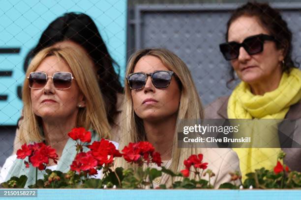 Rafael Nadal of Spain's sister Isabel Nadal and mother Ana Maria Parera watch Rafael Nadal of Spainagainst Darwin Blanch of USA on Day Two during...