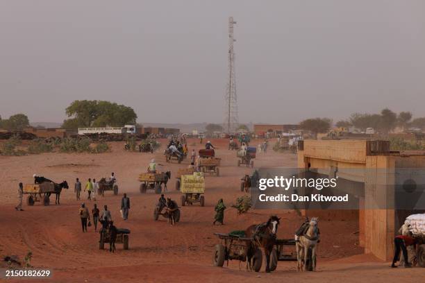 Goods move back and forth on horseback across the border between Sudan and Chad on April 25, 2024 in Adre, Chad. Since the beginning of the recent...