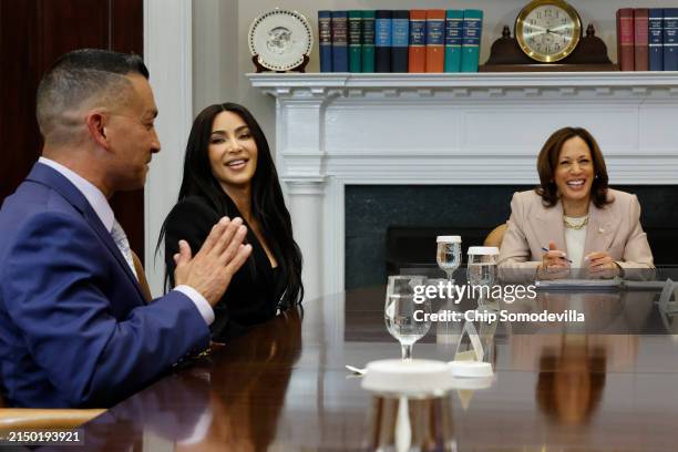 Reality television star and businesswoman Kim Kardashian joins Vice President Kamala Harris as they listen to Jason Hernandez during a roundtable...