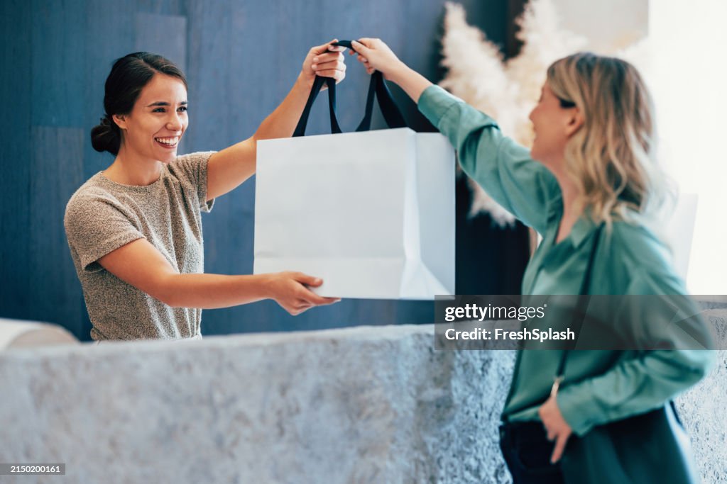 Friendly Exchange Between Women with a Shopping Bag