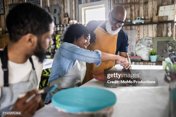 senior art studio instructor teaching students - funny hobby stock pictures, royalty-free photos & images