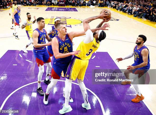 Anthony Davis of the Los Angeles Lakers takes a shot against Nikola Jokic of the Denver Nuggets in the first quarter during game three of the Western...