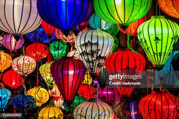 traditional silk hanging lanterns in hoi an city, vietnam - lantern stock pictures, royalty-free photos & images