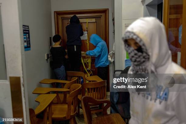 Demonstrators supporting Palestinians in Gaza barricade themselves inside Hamilton Hall, an academic building which has been occupied in past student...