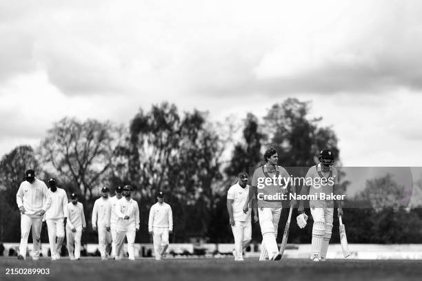 Tom Lammonby and Andy Umeed of Somerset walk off the pitch for the lunch break during a Vitality County Championship match between Worcestershire and...