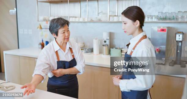 senior manager scold young staff - overworked waitress stock pictures, royalty-free photos & images