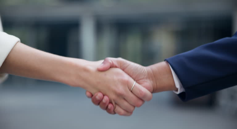 https://media.gettyimages.com/id/2150299648/video/handshake-interview-or-business-people-in-city-closeup-for-hiring-meeting-welcome-or-startup.jpg?b=1&s=640x640&k=20&c=1cOOXF72i_Vuwu_xK_eOe2-P9fBPxaTB7gbIGXSiV-s=