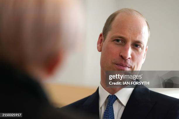 Britain's Prince William, Prince of Wales reacts as he visits the new centre at James' Place Newcastle, in Newcastle-upon-Tyne, north east England on...
