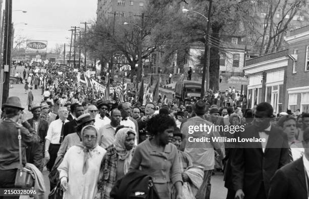 Protesters take part in a civil rights march to the capitol building in Montgomery, Alabama, US, 30th March 1965.