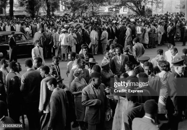 People outside Friends House, Euston Road, after a meeting following the Notting Hill race riots, London, 7th September 1958. The meeting was...